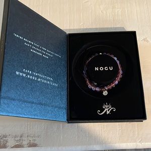 Nogu stretch bracelet. Pink mermaid glass. New in box. Never worn.